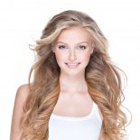 beautiful-happy-woman-with-long-curly-hair-PKY4FFN.jpg